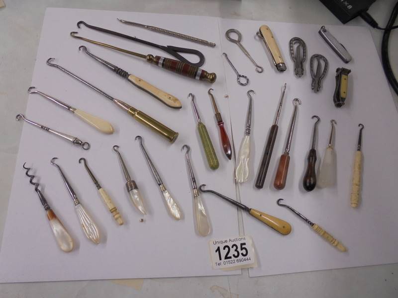 A good lot of assorted button hooks etc.,