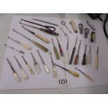 A good lot of assorted button hooks etc.,