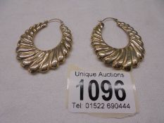 A pair of 9ct gold earrings, size 4.8 grams.