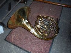 A brass French horn.
