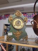 A heavy metal mantel clock. COLLECT ONLY.