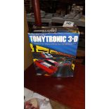 A boxed Thundering Turbo Tomytronic - 3-D