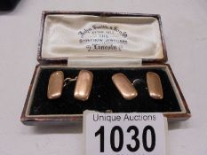 A cased pair of 9ct gold cuff links, 6.2 grams.