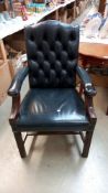 A deep buttoned leather carver chair (arms a/f) COLLECT ONLY