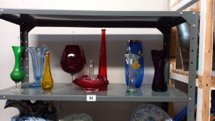 A selection of coloured glass vases etc