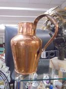 A large copper jug.