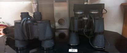 A pair of Prinzlux 12 x 50 and a pair of Prinz 10 x 50 binoculars with cases
