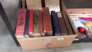 A box of old books including Peter Pan in Kensington gardens by J M Barrie