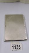 A silver monogrammed cigarette case, 6 ounces.