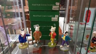 Four boxed John Beswick Rupert figures - Rupert Bear, Edward Trunk, Bill Badger and Podgy Pig.