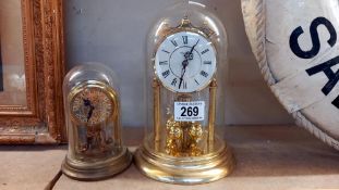 2 Anniversary clocks small one under plastic dome, large one under glass dome COLLECT ONLY