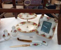 A Royal Albert Old Country Rose 2 tier cake stand, photo fram, cheeses knife, letter opener and salt