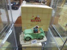 A boxed Royal Doulton Rupert figure "Bill and the Mysterious car"
