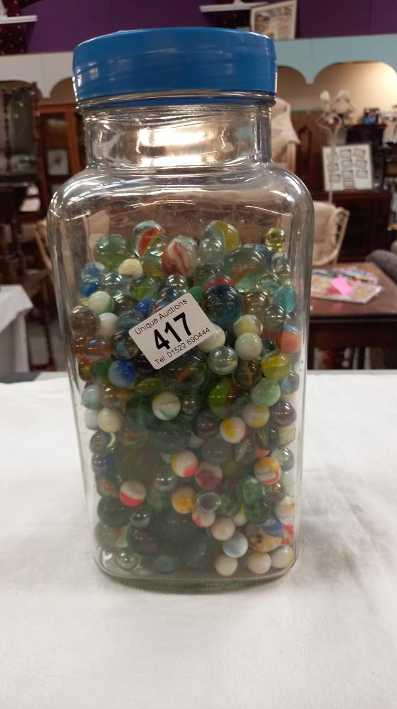 A large glass sweet jar of marbles COLLECT ONLY