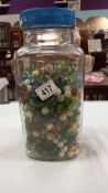 A large glass sweet jar of marbles COLLECT ONLY