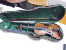 A cased violin with bow.