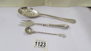 A silver fruit spoons, 2.6 ounces, a spoon with coin bowl and a silver handled pickle fork.