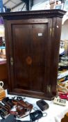 A 19th century oak corner cupboard with inlaid door and dentil cornice COLLECT ONLY
