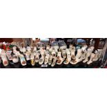 A large collection of crested china shoe ornaments etc