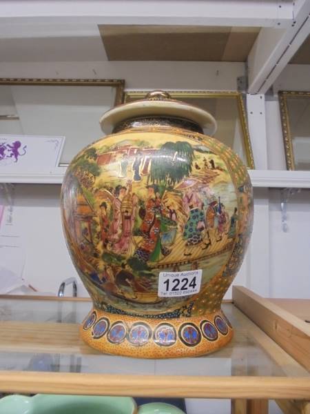 A hand painted lidded jar (Made in China) 28cm tall.