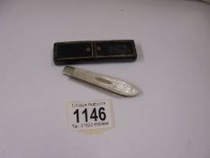 A cased silver and mother of pearl fruit knife.