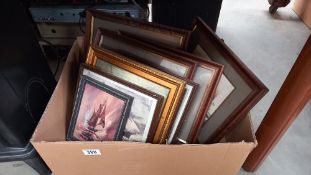 A box of various sized picture frames with pictures COLLECT ONLY