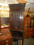 A Victorian carved oak corner cupboard on stand, COLLECT ONLY.
