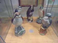 Five Beswick Gleneagles bird of prey decanters and a Royal Doulton example (some with contents).
