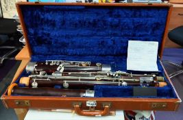 A cased G. M. Huller Germany bassoon