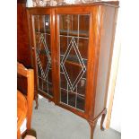 An Edwardian oak cabinet. COLLECT ONLY.