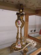 A gilded bronze French ormolu and porcelain table lamp, 30 cm tall.