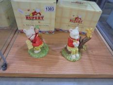 Two boxed Royal Doulton Rupert figures "The Little Sea Sprite" and 'We Meant to Put Them Back'