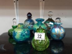 A quantity of glass perfume bottles and paperweights including Isle of white glass ( 2 missing