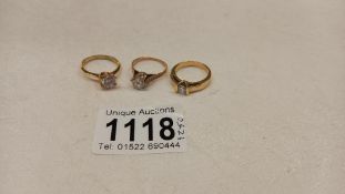 A 9ct gold ring size M half, 2.2 grams and two un-marked yellow metal rings, sizes M half and O.