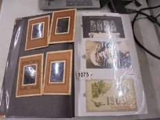 An album of in excess of 200 postcards including military, photo cards, topographical etc.,