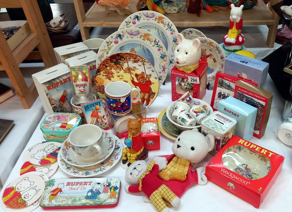 A large good selection of Rupert the bear collectables including Wedgwood book moneyboxes etc