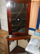 A Victorian astragal glazed corner cabinet on stand.