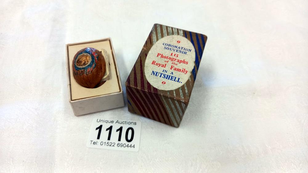 A George VI novelty, coronation souvenir, modelled as a walnut housing a concertina of 16