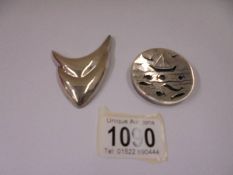 A Mexican silver brooch and one other. 38 grams.