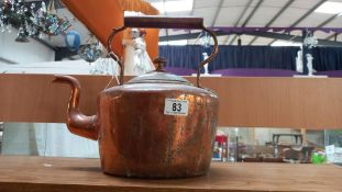 A large Victorian copper kettle