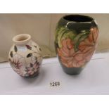 A vintage Moorcroft vase and another Moorcroft vase. smaller vase A/F with red dot