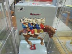 A boxed Royal Doulton Rupert figure "Hitching a Ride"