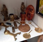 A selection of brass & copper including Britain's Pride Sailor door stops & shell cases etc. COLLECT