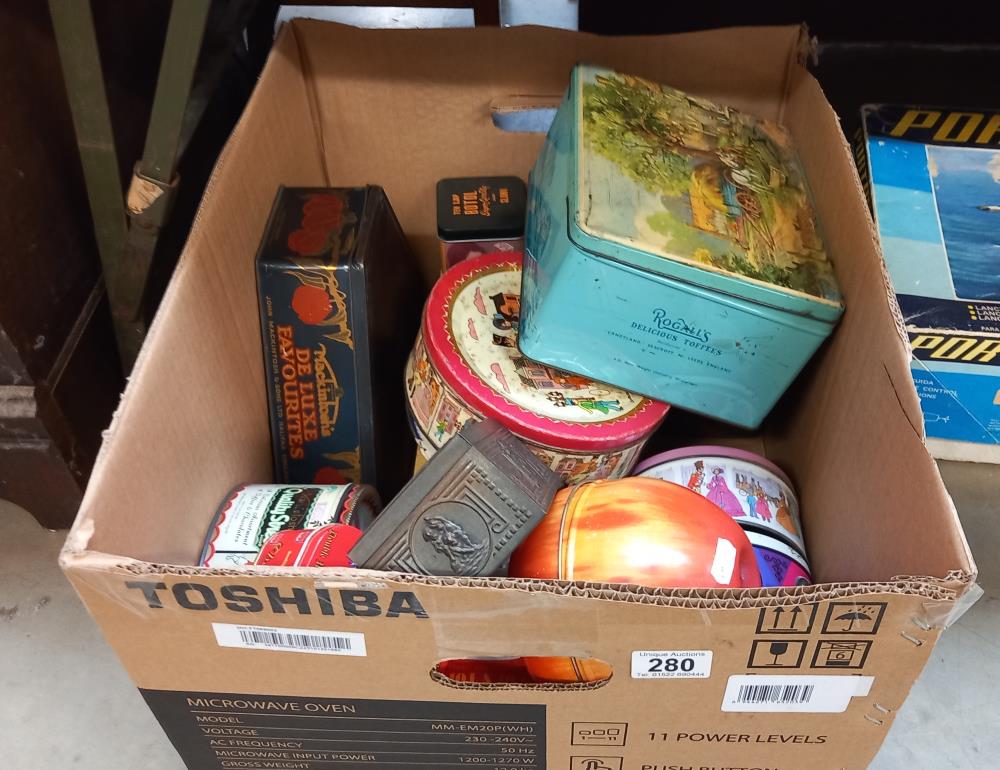 A large box of old tins including Mackintosh, state express cigarettes etc