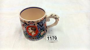 A Burleigh Ware coronation mug for King Edward VIII decorated with a colourful design by Dame