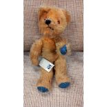 A vintage musical Teddy Bear with moving head (in working order)