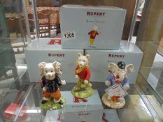 Three boxed Royal Doulton Rupert figures "Pong Ping", "Edward Trunk" and "Rupert Bear"