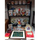 A good selection of Rupert The Bear collectables including pin badges, tins, mugs & money boxes etc.