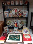 A good selection of Rupert The Bear collectables including pin badges, tins, mugs & money boxes etc.