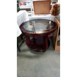 A dark wood stained round coffee table with bevel glass top Diameter 71cm, height 58cm COLLECT ONLY